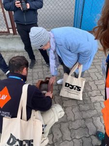 woman at Ukraine border with cat in bag